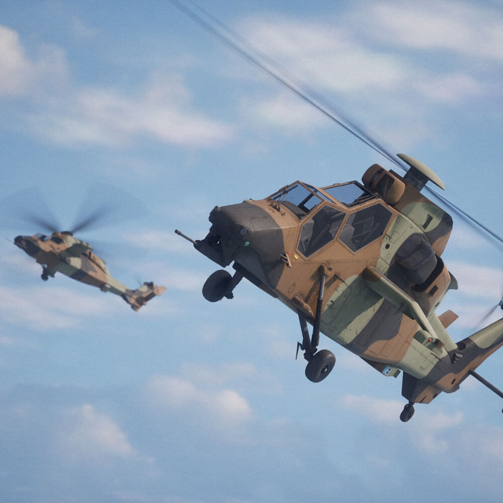 Two military helicopters are flying in a blue sky with clouds, one in a steep climb and the other in the background.