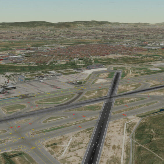 Aerial view of an airport with runways, taxiways, and surrounding urban landscape in the background.